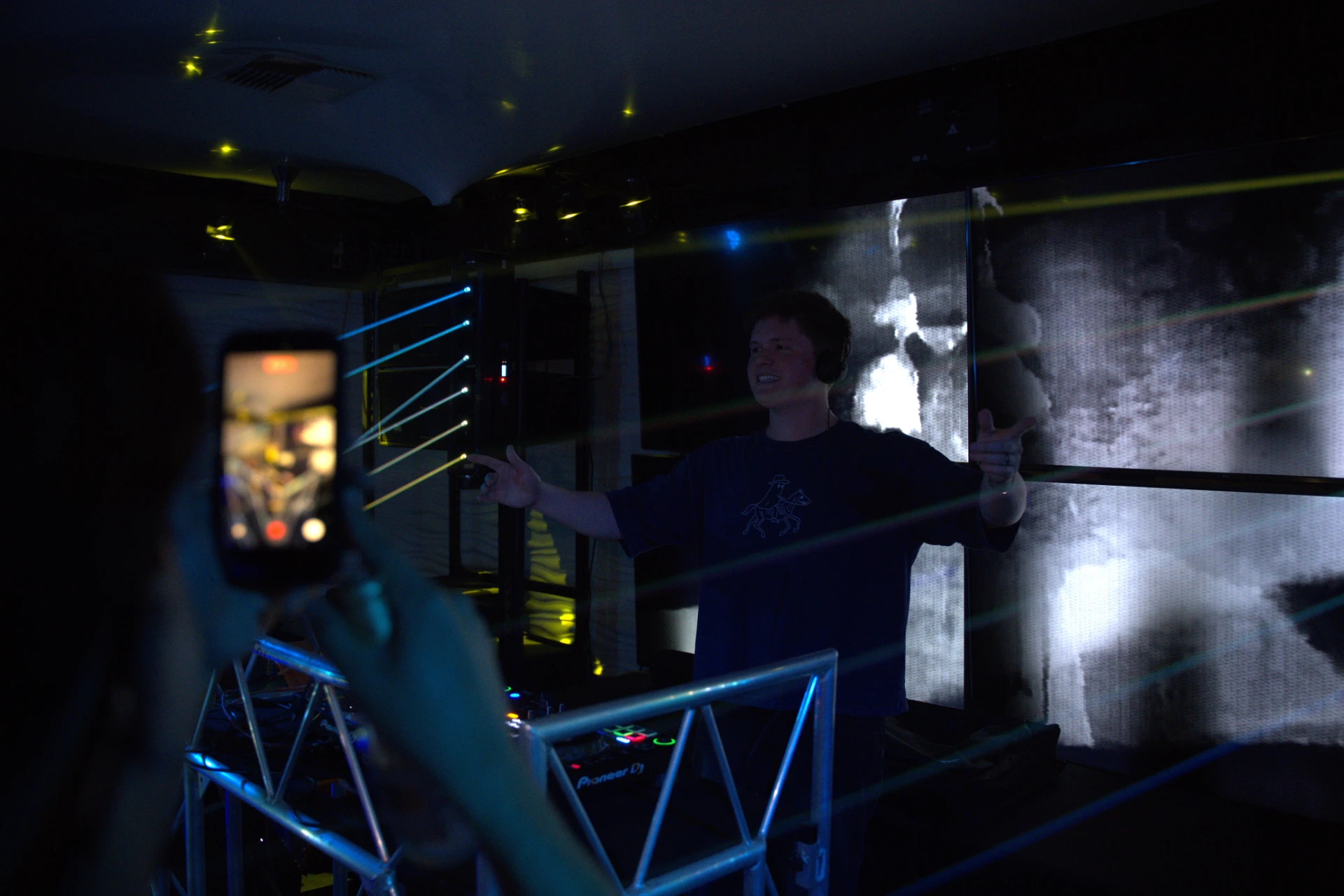 Jason Kushy in a music studio environment surrounded by production tools