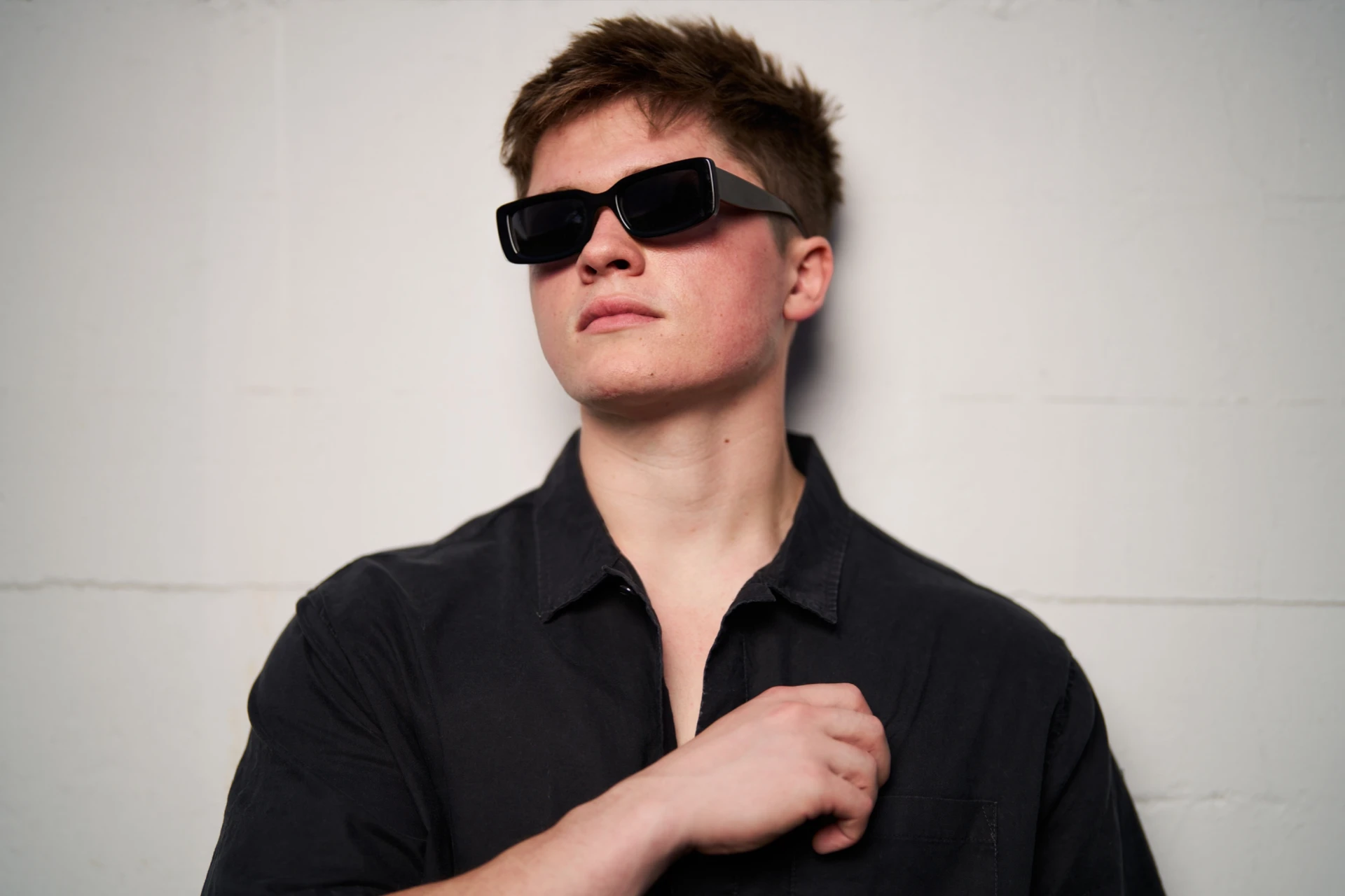 Street style portrait of Jason Kushy showcasing modern house music artist branding