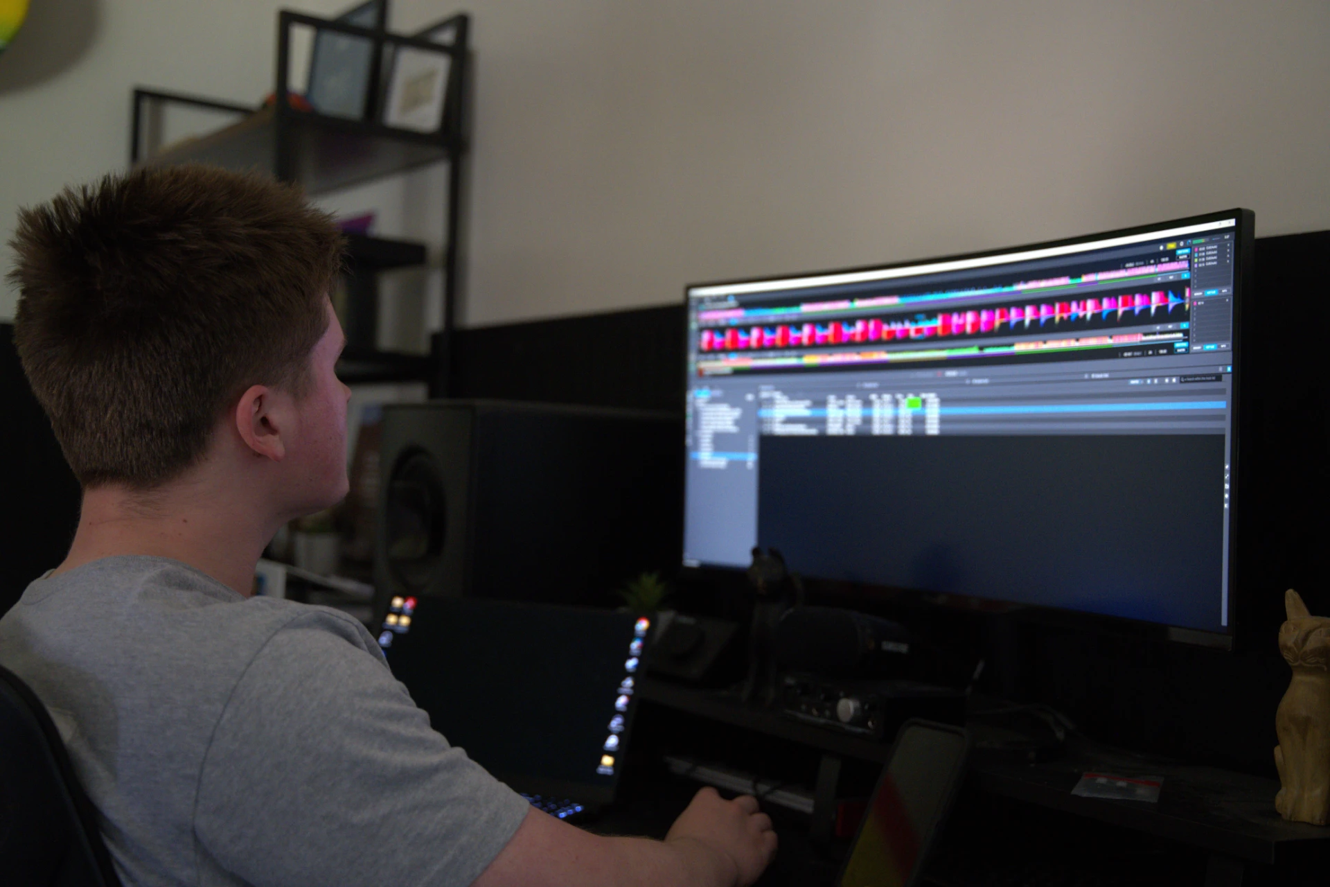 Action shot of Jason Kushy mixing tracks in a professional music studio