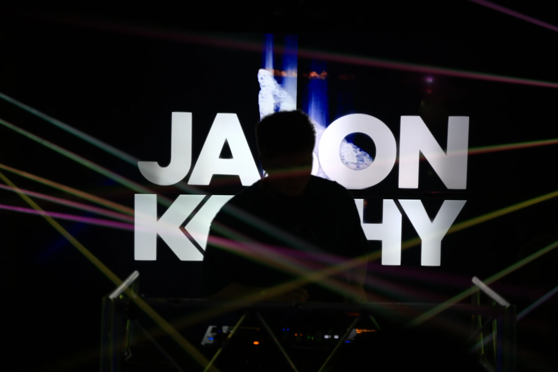Jason Kushy focused at the studio console producing tech house music